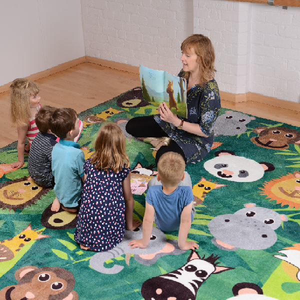 Teacher and children sat on a Wild Animals Carpet 3x3m