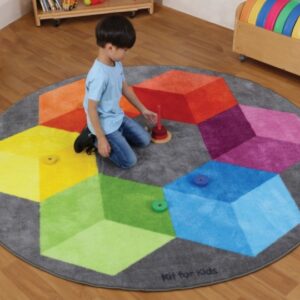 Child sat on a Rainbow Circular Polygons Carpet 2m in diameter