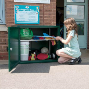 School child putting items into an Outdoor Steel Cabinet ES800