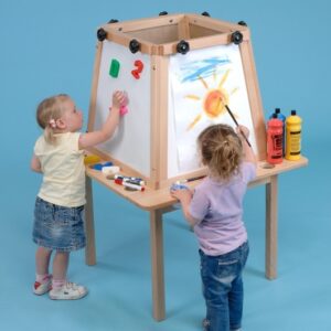 Tow children using a 4 sided square easel. One child is painting, the other is using the magnetic easel surface to play with magnetic letters