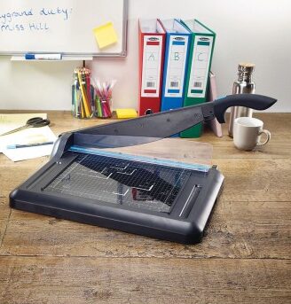 Avery A4 Office Guillotine shown on desk with blade up.
