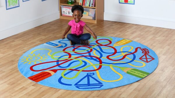 Little girl sat on a circular colour tubes classroom carpet 2m diameter