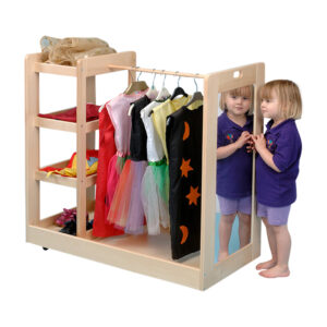 Child looking in the mirror at the end of a beech dressing up trolley for nurseries or primary classroom. Trolley has four shelves, hanging rail and mirror