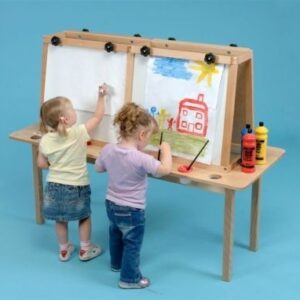 two children on one side of a 4 person table easel painting pictures