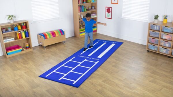 Child playing on a Balance Beam and Ladders Carpet