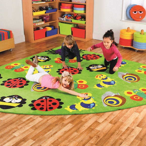 Children sitting on a Corner Bug Carpet 3x3m