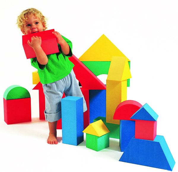 Young child playing with Edushape Giant Foam Blocks in bright colours and many shapes