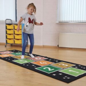 child playing on a hopscotch carpet