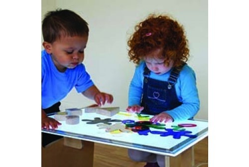 Two children playing with A2 light panel