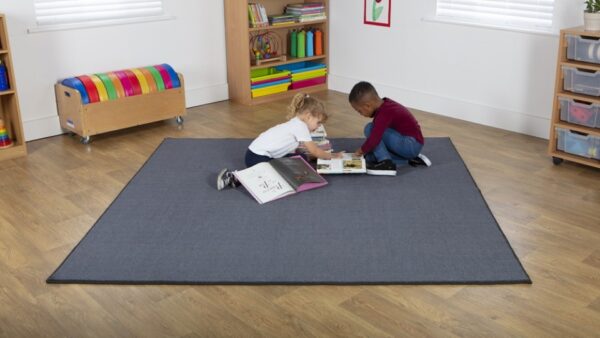 Two children sat reading on a Luxury Square Carpet - Grey