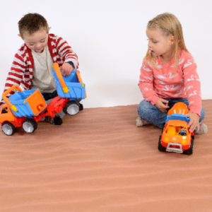 Tow children playing on a Nature Play Mat Sand themed