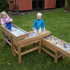 Outdoor water and sand multi table trays with pump lets young children learn about gravity