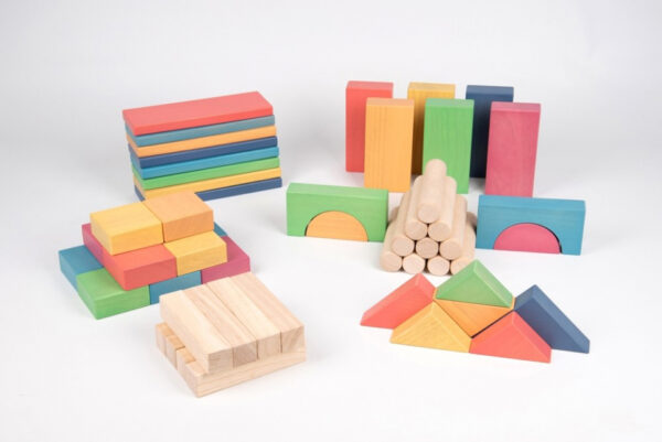 Set of 54 rainbow wooden blocks in various shapes including arches, cylinders, square, rectangles and triangles. Both natural and rainbow in colour