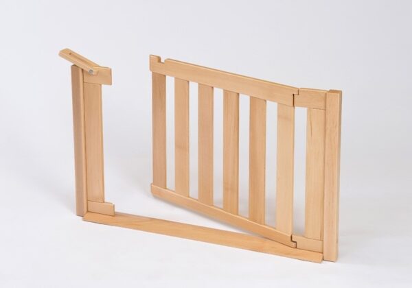 Room Scene Gate from solid beech with a latch on the top of the fence-style opening gate panel