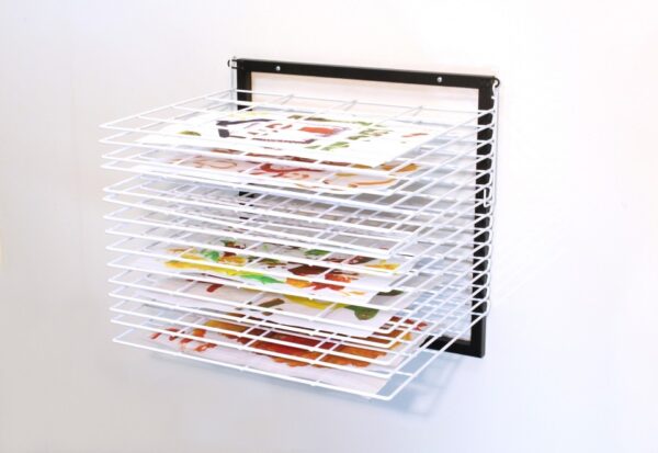 Wall mounted art drying rack for school artwork with 15 wire shelves that fold back when not in use