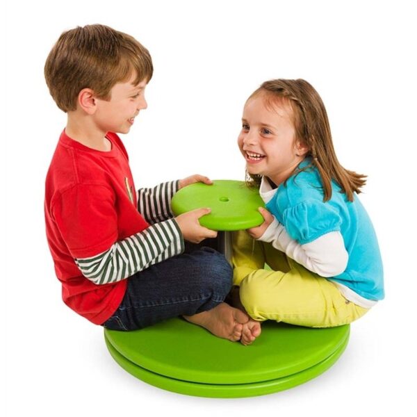 Two children sat on whizzy dizzy spinning toy
