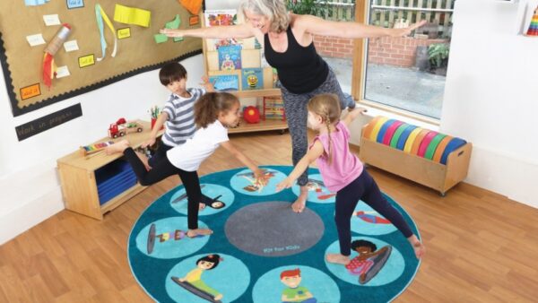 Teacher and children using a Yoga Position Carpet 2m circle