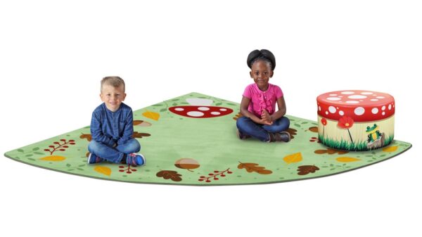 Children sat on a forest friends corner carpet which has images of autumnal leaves and berries with pale green background