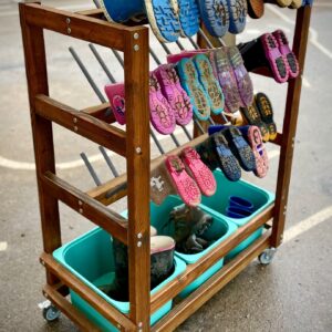 Wooden mobile welly rack with pegs for up to 30 pairs of wellies and 3 storage trays underneath