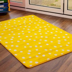 Nursery rug with yellow spots on wooden classroom floor